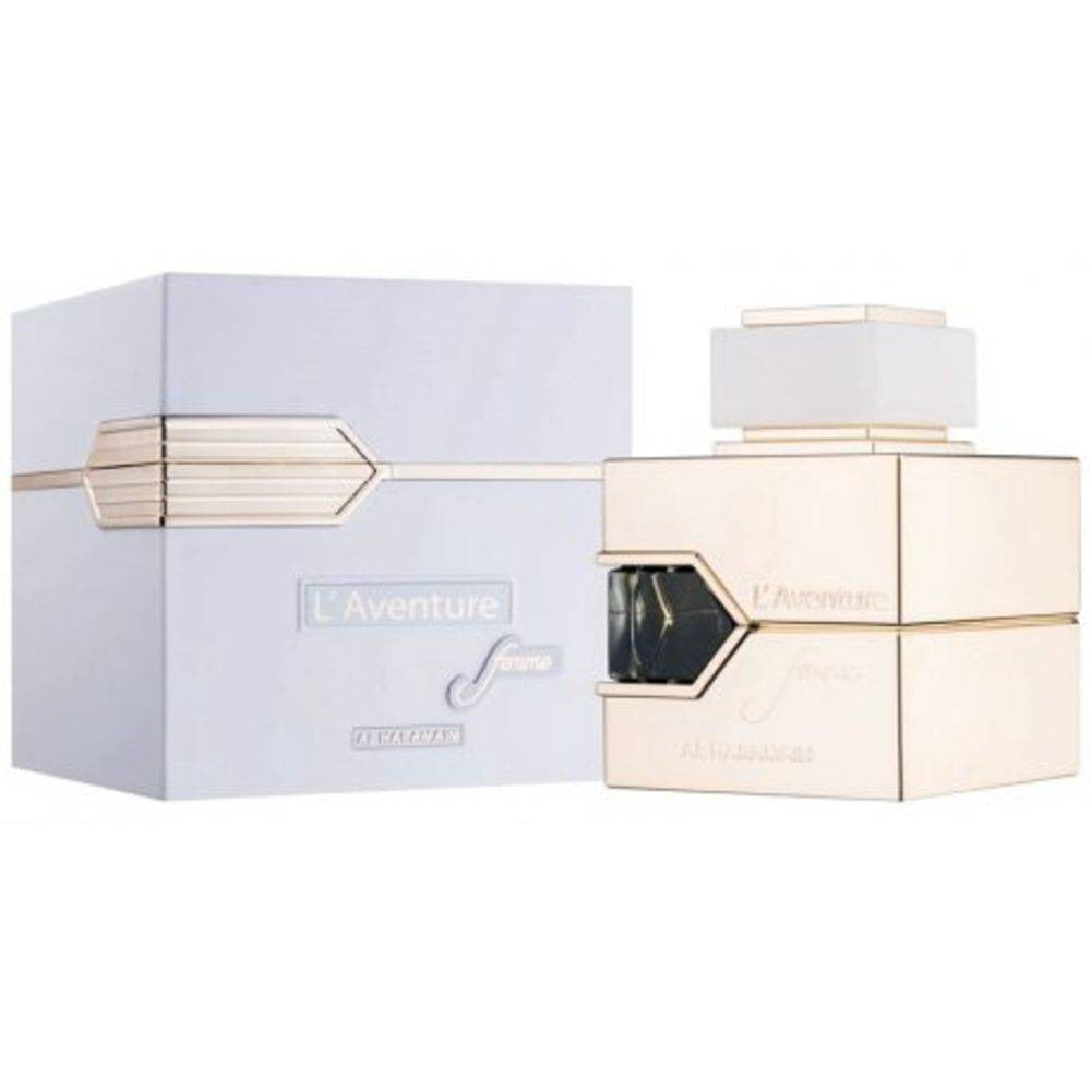 A sleek, square perfume bottle with a silver finish rests beside its matching box. The minimalist text on the bottle reads AL HARAMAIN LAVENTURE FEMME 3.4 EDP SP, showcasing a modern design with simple lines and a luxurious touch.